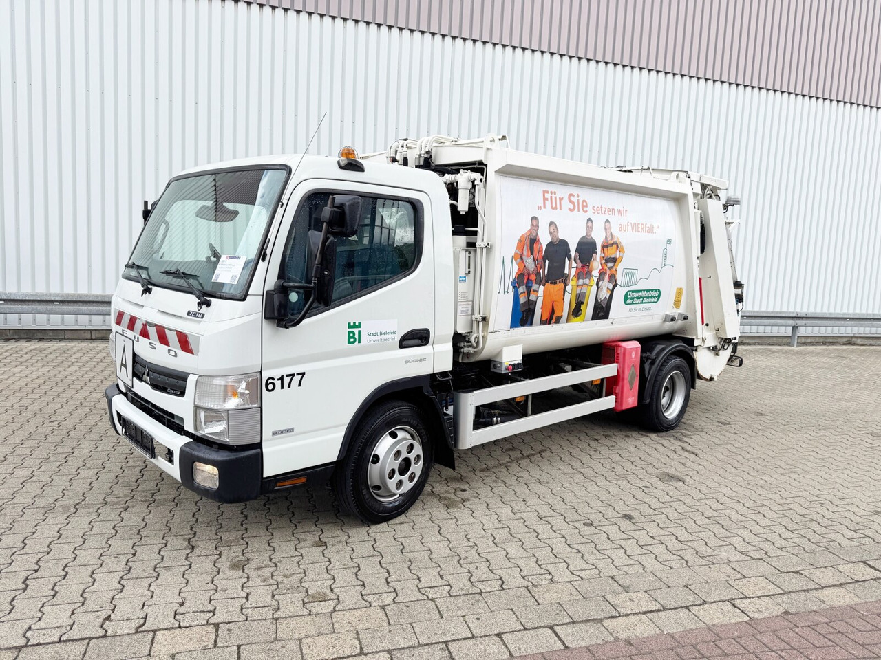 Mitsubishi Fuso 7C18 4x2 Fuso 7C18 4x2, EEV, Zöller ASF HL Micro XL, Zöller Schüttung - Camión: foto 1 Mitsubishi Fuso 7C18 4x2 Fuso 7C18 4x2, EEV, Zöller ASF HL Micro XL, Zöller Schüttung - Camión: foto 1