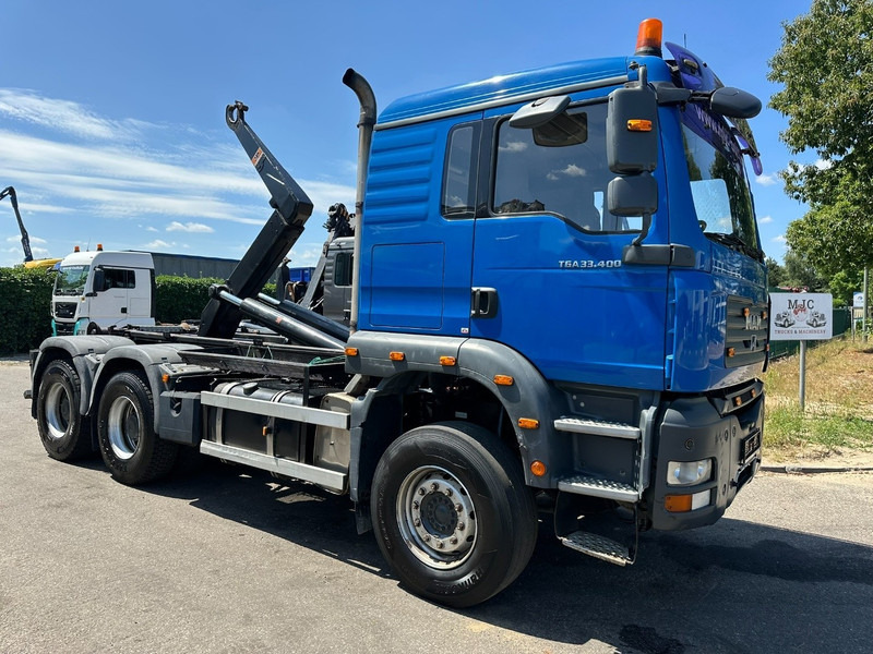 MAN TGA 33.400 6X4 HOOKLIFT AJK NHS20-4930mm - WB 3m60 - MANUAL ZF - STEEL SPRING / BLATT - BIG AXLES / AP ACHSEN - Multibasculante camión: foto 1 MAN TGA 33.400 6X4 HOOKLIFT AJK NHS20-4930mm - WB 3m60 - MANUAL ZF - STEEL SPRING / BLATT - BIG AXLES / AP ACHSEN - Multibasculante camión: foto 1