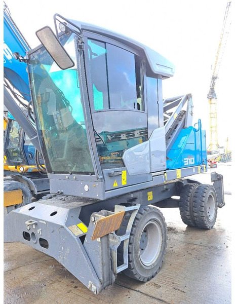 Manipulador de materiales para transporte de basura Fuchs MHL 310: foto 8