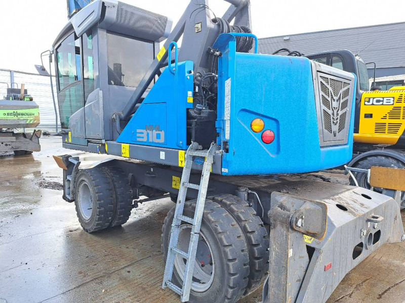 Manipulador de materiales para transporte de basura Fuchs MHL 310: foto 6