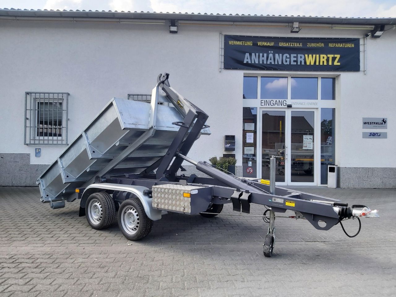 Hakenlift Anhänger Kipper KONOS 3500 elektro hydraulisch 3500kg mit Container Mulde - Volquete remolque: foto 1 Hakenlift Anhänger Kipper KONOS 3500 elektro hydraulisch 3500kg mit Container Mulde - Volquete remolque: foto 1