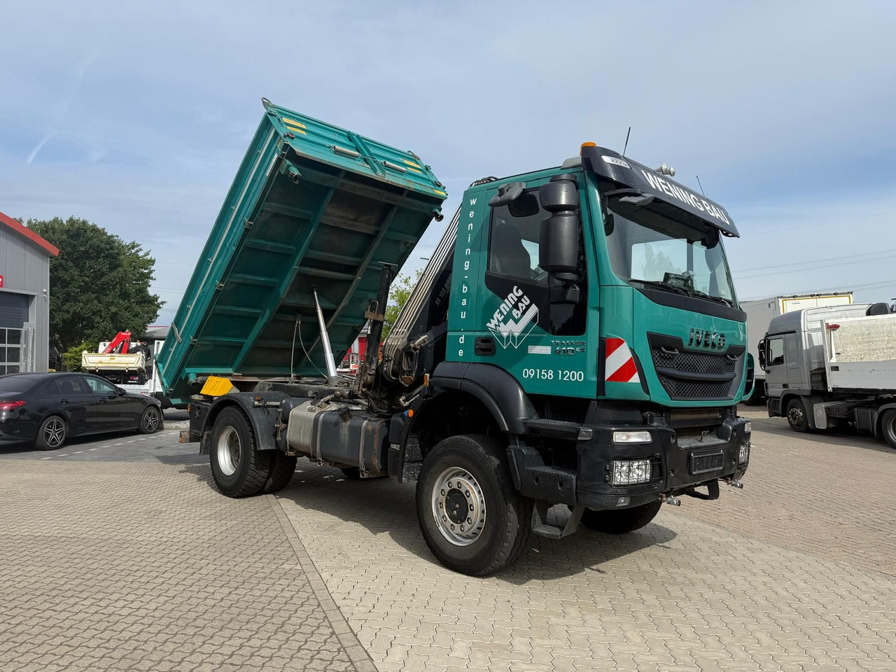 Iveco AD190 T/W Trakker 410 4x4 Allrad Kran KipperHIAB - Volquete camión, Camión grúa: foto 2 Iveco AD190 T/W Trakker 410 4x4 Allrad Kran KipperHIAB - Volquete camión, Camión grúa: foto 2