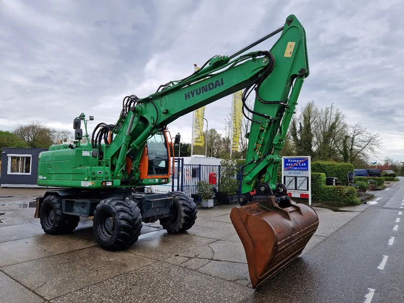 Hyundai Robex 160W-9A with 6-cylinder Cummins - Excavadora de ruedas: foto 2 Hyundai Robex 160W-9A with 6-cylinder Cummins - Excavadora de ruedas: foto 2