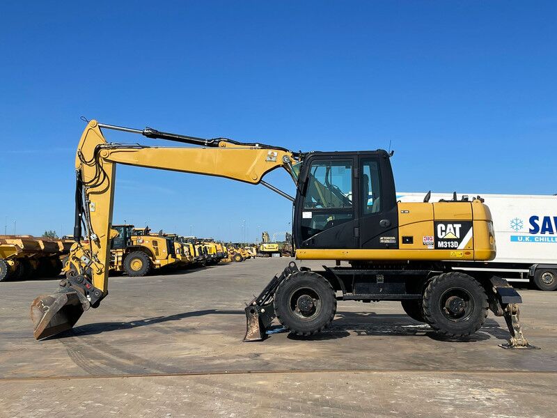 Caterpillar M313D VA - Outriggers + Blade - Excavadora de ruedas: foto 1 Caterpillar M313D VA - Outriggers + Blade - Excavadora de ruedas: foto 1