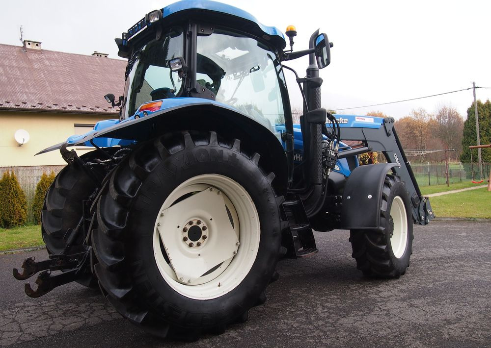 Ciągnik New Holland NH TS125A 6 cylindrów 2004 Ciągnik rolniczy New Holland TS125A - Tractor: foto 4 Ciągnik New Holland NH TS125A 6 cylindrów 2004 Ciągnik rolniczy New Holland TS125A - Tractor: foto 4