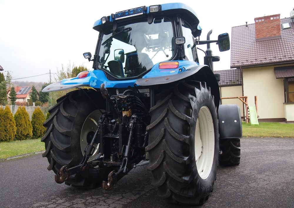 Ciągnik New Holland NH TS125A 6 cylindrów 2004 Ciągnik rolniczy New Holland TS125A - Tractor: foto 5 Ciągnik New Holland NH TS125A 6 cylindrów 2004 Ciągnik rolniczy New Holland TS125A - Tractor: foto 5