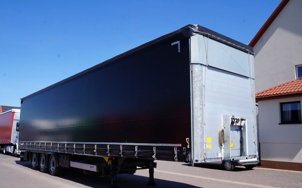 Schmitz Cargobull VARIOS FIRANKA 2 POZIOMY JAZDY OŚ PODNOSZONA OCYNK - Semirremolque lona: foto 1 Schmitz Cargobull VARIOS FIRANKA 2 POZIOMY JAZDY OŚ PODNOSZONA OCYNK - Semirremolque lona: foto 1