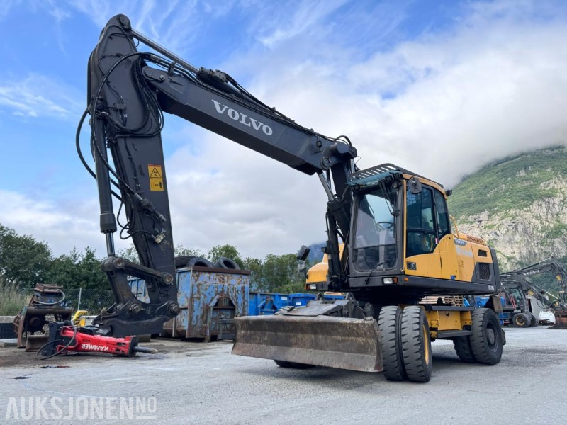 2018 Volvo EW210D Hjulgraver - S70 HK feste - Sentralsmøring - Hammerhydraulikk/tilleggshydraulikk - Multi-X - 1 tannskuffe - Excavadora: foto 1 2018 Volvo EW210D Hjulgraver - S70 HK feste - Sentralsmøring - Hammerhydraulikk/tilleggshydraulikk - Multi-X - 1 tannskuffe - Excavadora: foto 1