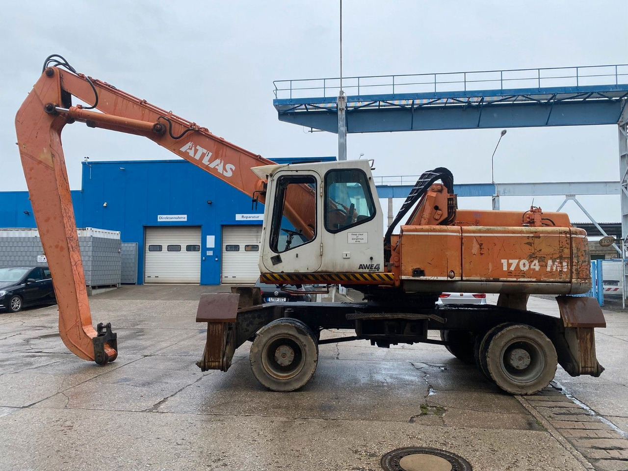 Atlas 1704 MI mit Greifer Umschlagbagger Lang - Excavadora de ruedas: foto 1 Atlas 1704 MI mit Greifer Umschlagbagger Lang - Excavadora de ruedas: foto 1