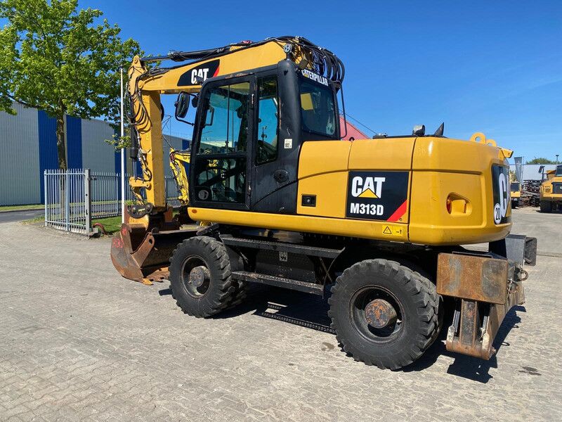 Caterpillar M313D . - Excavadora de ruedas: foto 1 Caterpillar M313D . - Excavadora de ruedas: foto 1