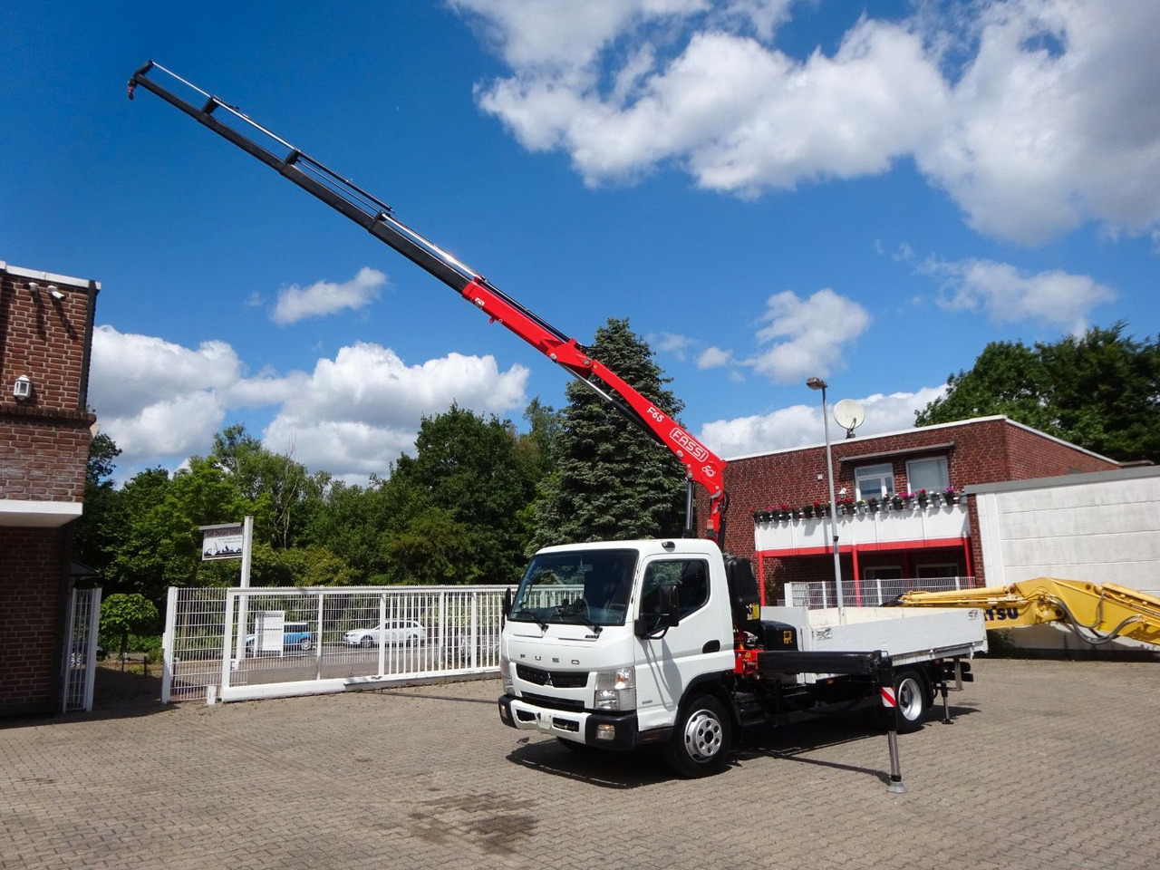FUSO Canter 7C15 mit FASSI F65A Kran - Caja abierta furgoneta: foto 1 FUSO Canter 7C15 mit FASSI F65A Kran - Caja abierta furgoneta: foto 1