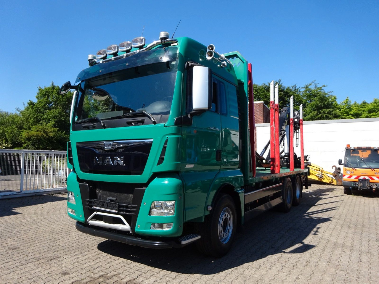 MAN 33.560 TGX mit TAJFUN L150Z Holzladekran 6x4 - Camión forestal, Camión grúa: foto 1 MAN 33.560 TGX mit TAJFUN L150Z Holzladekran 6x4 - Camión forestal, Camión grúa: foto 1