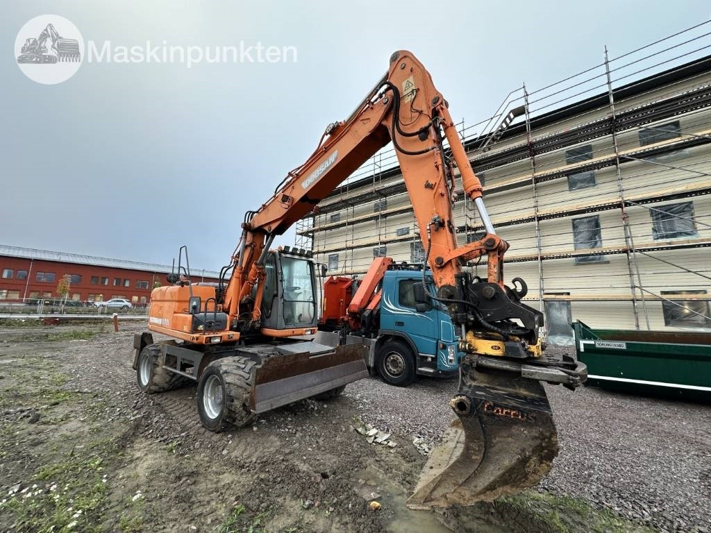 Doosan DX 140 W med vagn och redskap - Excavadora de ruedas: foto 2 Doosan DX 140 W med vagn och redskap - Excavadora de ruedas: foto 2