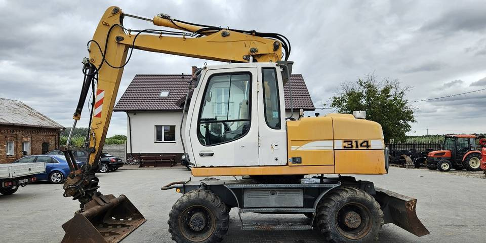 Koparka kołowa Liebherr A314 Litronic 9350 h+ 5 łyżek kołówka - Excavadora de ruedas: foto 1 Koparka kołowa Liebherr A314 Litronic 9350 h+ 5 łyżek kołówka - Excavadora de ruedas: foto 1