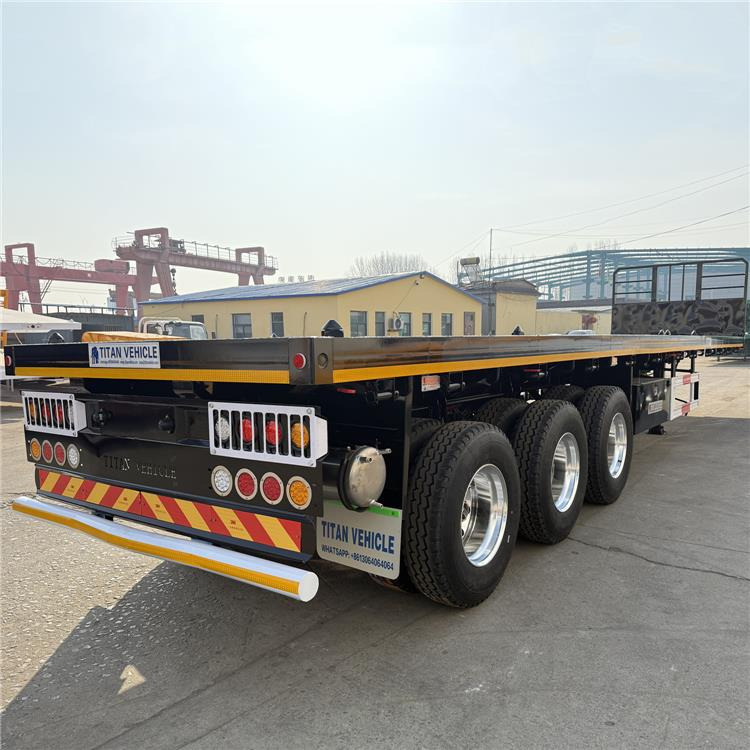 TITAN 12.5M 3 Axle Flat Deck Trailer for Sale In Tanzania - Portacontenedore/ Intercambiable semirremolque: foto 1 TITAN 12.5M 3 Axle Flat Deck Trailer for Sale In Tanzania - Portacontenedore/ Intercambiable semirremolque: foto 1