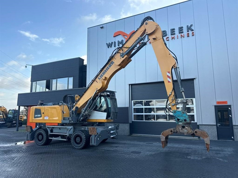 Manipulador de materiales para transporte de basura Liebherr LH 30 M: foto 10