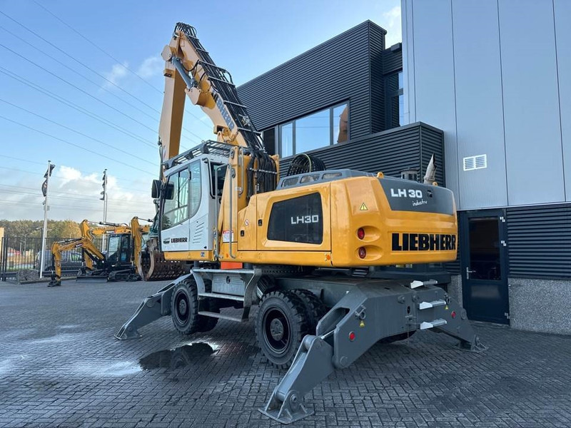 Manipulador de materiales para transporte de basura Liebherr LH 30 M: foto 7