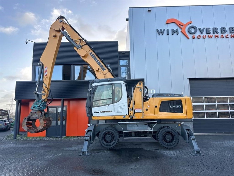 Manipulador de materiales para transporte de basura Liebherr LH 30 M: foto 6