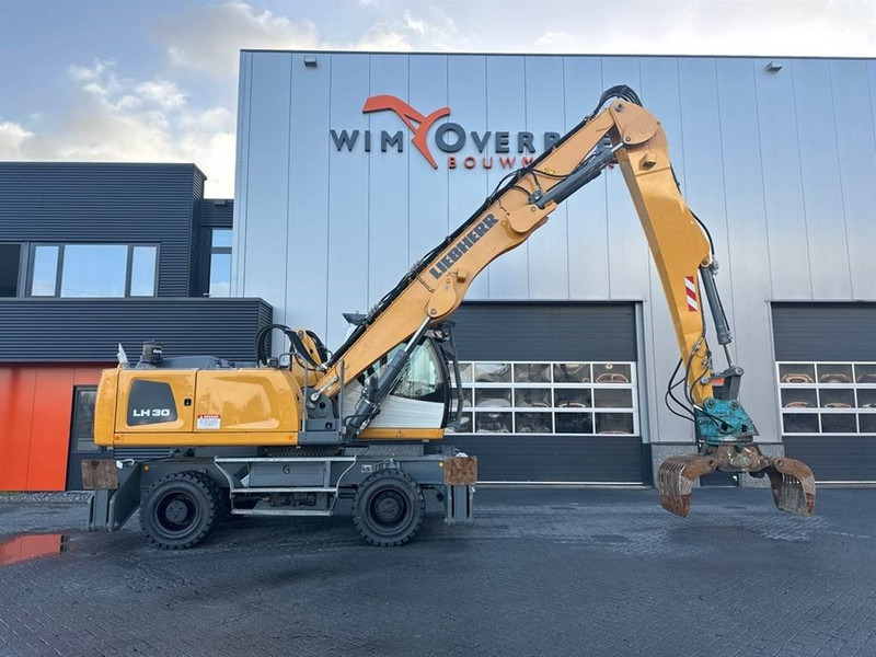 Manipulador de materiales para transporte de basura Liebherr LH 30 M: foto 9