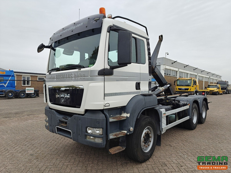 MAN TGS-TGX 26.440 6x4 Dagcabine Euro5 - AJK 20T HaakarmSysteem - Volledig Bladgeveerd - Naafreductie - Handgeschakeld - Multibasculante camión: foto 1 MAN TGS-TGX 26.440 6x4 Dagcabine Euro5 - AJK 20T HaakarmSysteem - Volledig Bladgeveerd - Naafreductie - Handgeschakeld - Multibasculante camión: foto 1