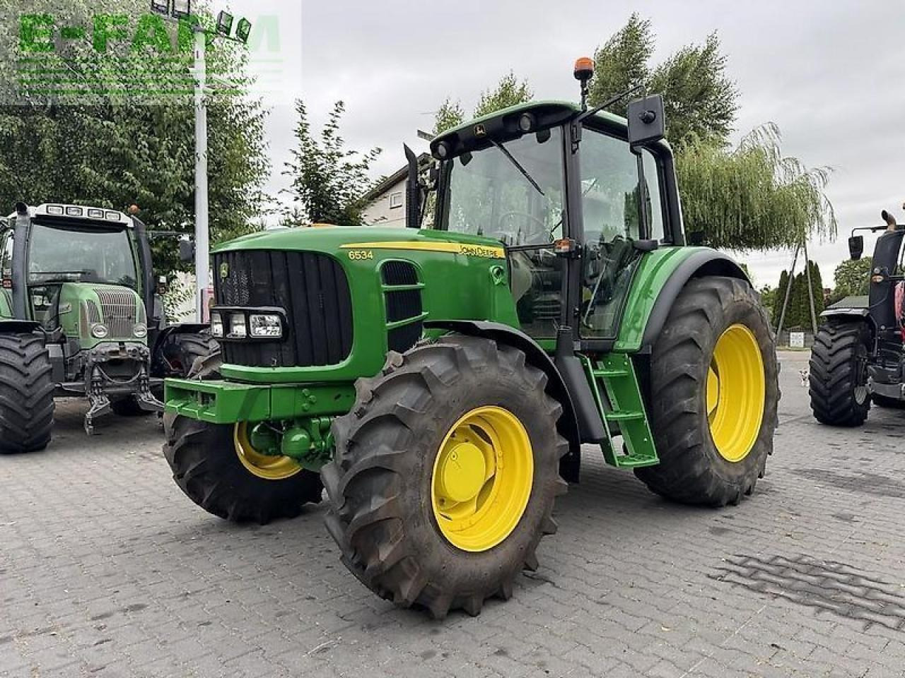 John Deere 6534 - Tractor: foto 1 John Deere 6534 - Tractor: foto 1