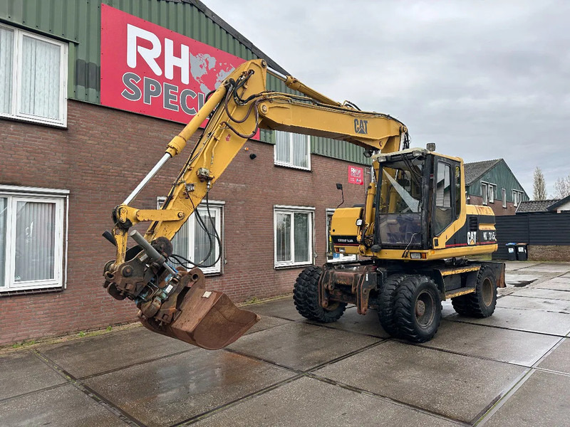 Caterpillar M315 +ROTO CE - Excavadora de ruedas: foto 2 Caterpillar M315 +ROTO CE - Excavadora de ruedas: foto 2