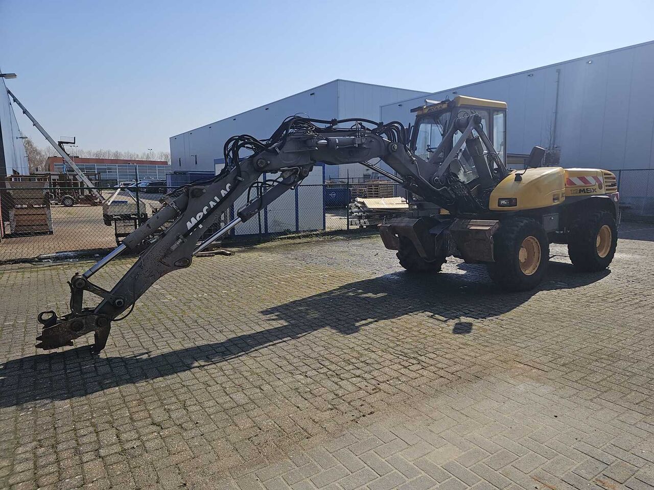 MECALAC - 12MSX - INCL. BUCKETS + PALLET FORKS - MOBILE CRANE - Retroexcavadora: foto 1 MECALAC - 12MSX - INCL. BUCKETS + PALLET FORKS - MOBILE CRANE - Retroexcavadora: foto 1