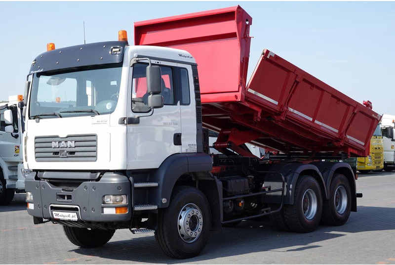 MAN TGA 33.390 / 6X4 / WYWROTKA 2 STRONNA / HYDROBURTA / MANUAL / SP - Volquete camión: foto 1 MAN TGA 33.390 / 6X4 / WYWROTKA 2 STRONNA / HYDROBURTA / MANUAL / SP - Volquete camión: foto 1